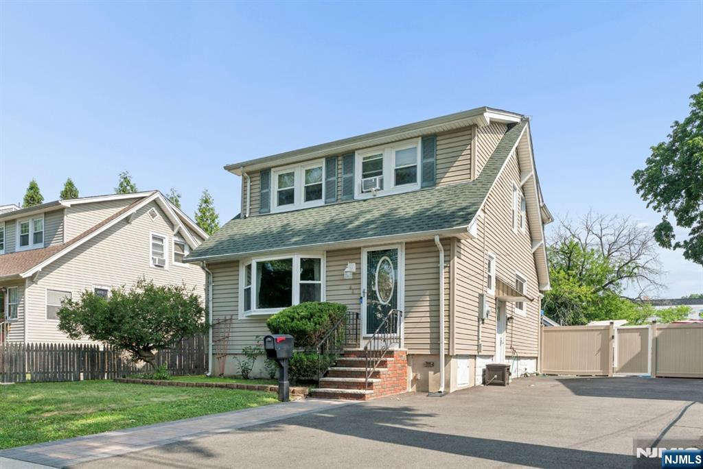 Welcome home to this beautifully maintained expanded Side Hall Colonial, where classic charm meets modern updates! This move-in ready home features a welcoming living room, dining room, beautifully updated kitchen, 1.5 updated baths, and 3 bedrooms, each with deep closets offering abundant storage. The finished basement provides valuable additional flex space, perfect for a recreation room, home office, gym etc. Step outside to a fully fenced backyard with a newer deck, creating the ideal setting for relaxing, entertaining, or enjoying outdoor activities. Numerous updates throughout include newer windows, deck, washer and dryer, front paver walkway, driveway and many other additional improvements. A former garage has been thoughtfully converted into a spacious storage area, offering excellent flexibility for storage, hobbies, or a workshop. Conveniently located near shopping, restaurants, parks, schools, and major highways, this home combines comfort, functionality, and an unbeatable location. Simply unpack and move right in!