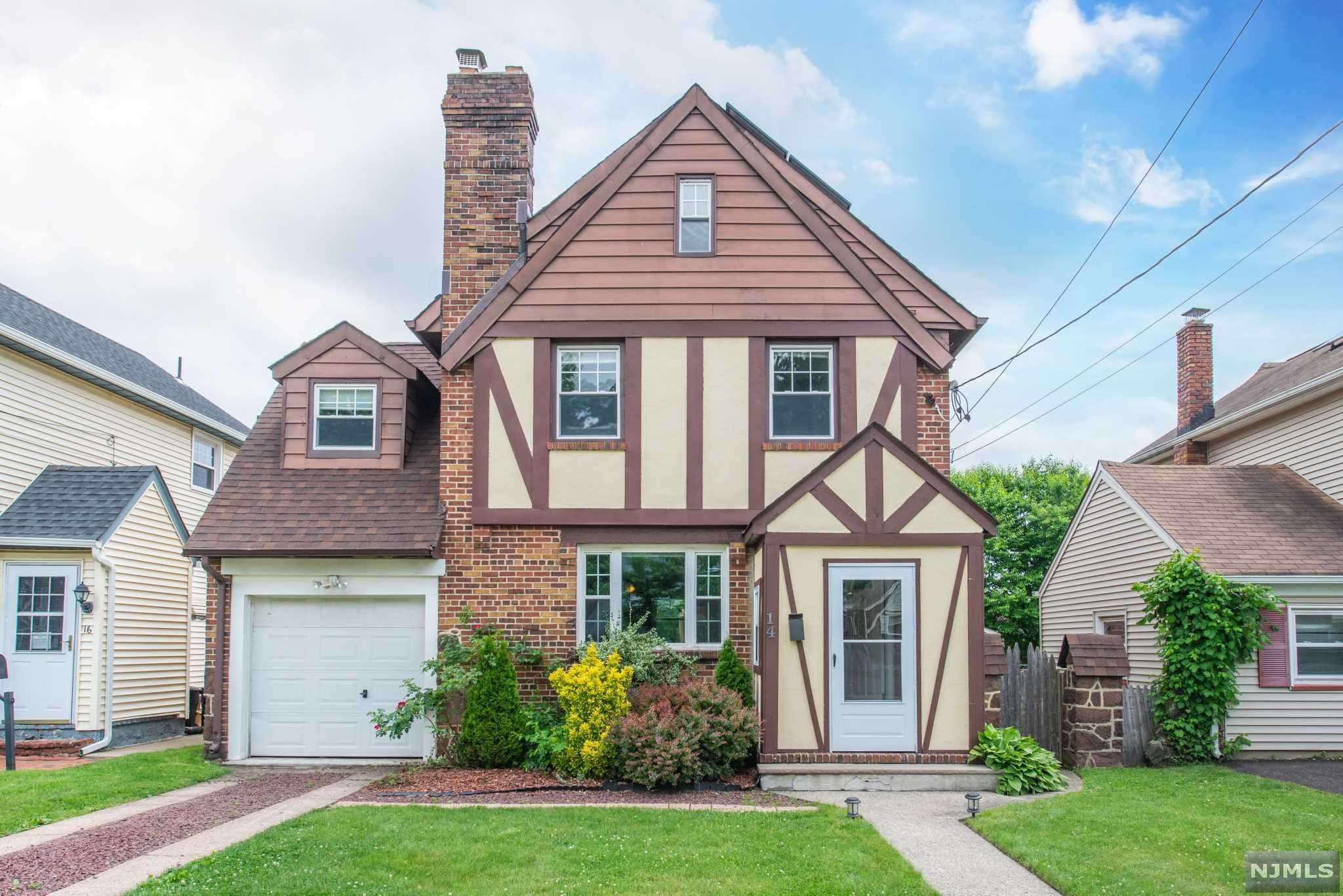 Beautiful tudor style home on a lovely block close to schools, parks and NYC transportation. First floors offers a bright living room/dining room combo, a nice size kitchen and a full bath. The living room also has a fireplace(in as-is condition). The second floor has 3 bedrooms and a very large full bath. There is also a finished basement for additional living space. The home has hardwood floors throughout, central heat and air conditioning and an attached one car garage. The back yard is large and great for entertainment.