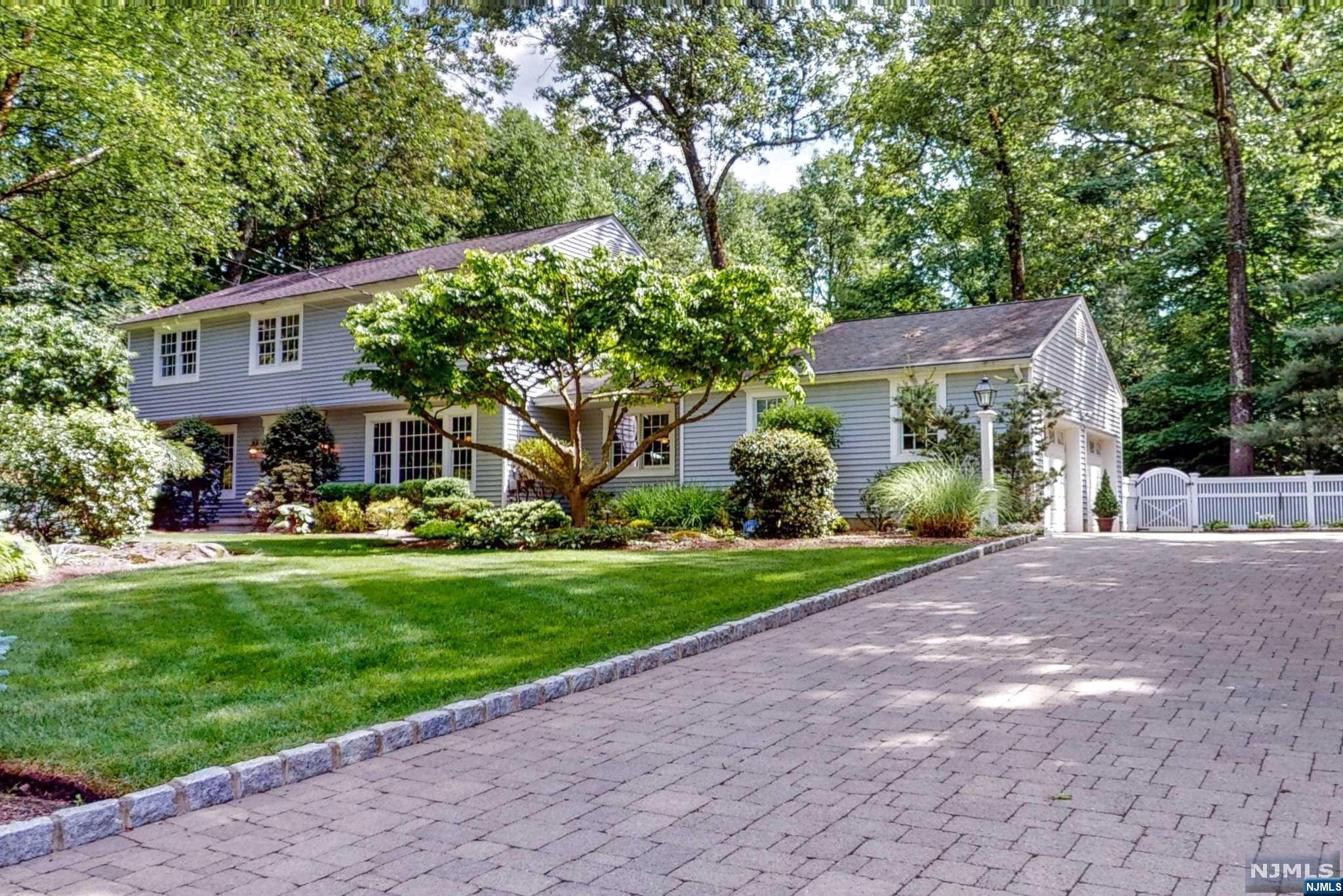 Discover splendor and elegance at this stunning 4 bed 2.5 bath residence, on a meticulously maintained 1.3 acres in the Fardale section of Mahwah. This home is designed to impress, offering a blend of modern amenities and timeless sophistication. Enter into the welcoming foyer leading to a spacious light-filled living area, perfect for relaxing and entertaining. The heart of the home is the gourmet kitchen, featuring top of the line appliances, granite countertops, and 2 dishwashers. Radiant heat in the kitchen ensures warmth and comfort. The primary BR is a true retreat, boasting a generous bedroom with ensuite bathroom with radiant heat floors. 3 additional bedrooms provide plenty of room for loved ones and guests. Outside, an oasis awaits. A Brazilian walnut deck overlooks a heated gunite pool, perfect for summer gatherings and relaxation. The backyard is beautifully landscaped, offering a serene setting. Other features of this home include an EV charger and generator hookup