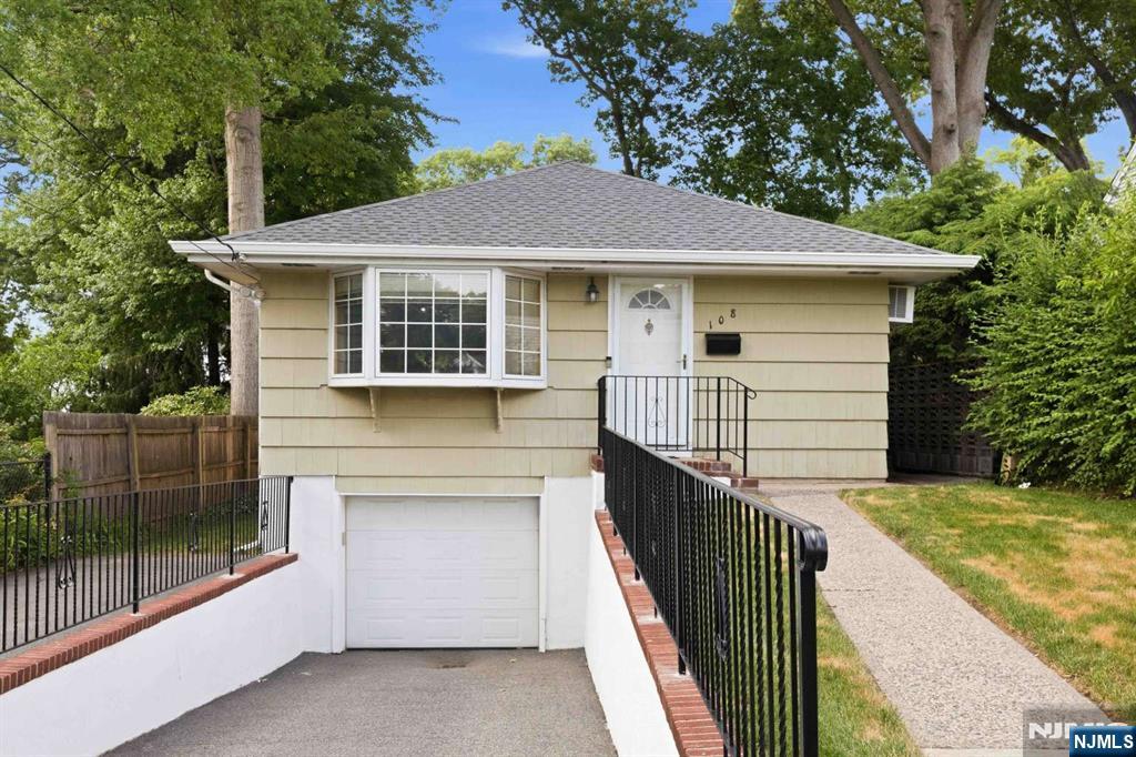 Move right into this 3-bedroom home featuring hardwood floors, updated kitchen and bath, and a fully finished basement with a half bath. Recent improvements include a brand new roof and gutters. The one car attached garage offers convenient interior access to the home. Enjoy the private backyard and convenient location close to schools, parks, and transportation. A home warranty is included for the buyer, providing added peace of mind. Don't miss this move-in ready opportunity! **Seller holds a NJ real estate license.