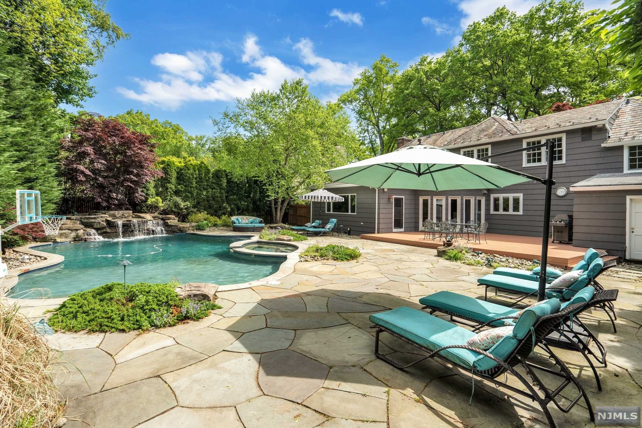 Welcome to sun-filled, spacious CHC on tree-lined street in charming, neighbor friendly cul-de-sac Fieldstone area of Up. Mtc near NYC bus, Applegate Farms & more! Classic layout w/open plan from entry foyer to FDR, LR w/WBFP & to EIK & family rm. Features 5 BR & 3.5 BA incl primary BR & BA, 3 addl BR & BA on 2nd fl & BR & BA in sep wing-ideal home ofc. EIK to family rm overlooking bluestone patio & pool. Fabulous stay-cation oasis w/custom designed eco & body healthy salt-water pool w/multiple waterfalls, multicolored lights & natural rock ledge dive platform & surround plus attached hot tub. Kitchen cherry cabinets, granite & SS & sep eating area open to generous family rm for gathering. Plus CA & AC split system, hdwd floors, oversize garage & 4 car drvwy parking. Bsmt w/2 large fin. rms rec/office/gym plus laundry&storage. Near schools, parks, restaurants, shops, worship & Bonsal Nature Preserve, Iris Gardens, Mills Reservation & MSU events.Come home to Montclair! PHOTOS SOON!