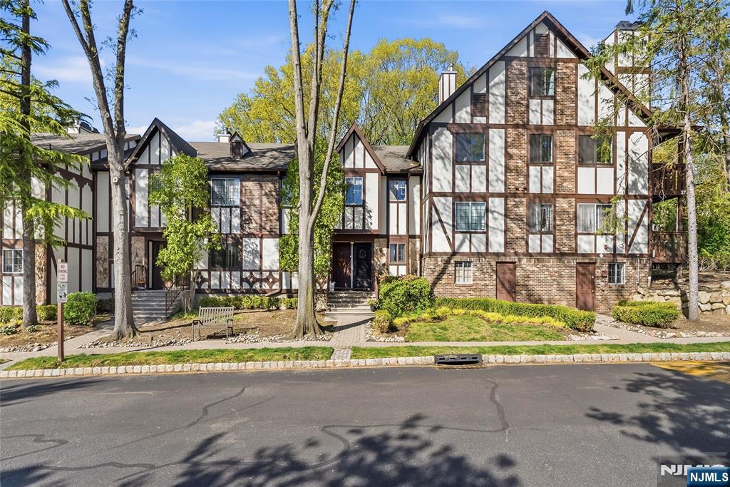 Enjoy low-maintenance living in this well-kept 2-bedroom, 2-bath condo located in the sought-after Ridge Gardens community. This home offers a bright, open layout with an updated kitchen with an open living and dining area, creating a comfortable space for both everyday living and entertaining. A wood-burning fireplace adds a cozy touch, while the covered private balcony provides the perfect place to relax. Additional features include in-unit laundry, parking, and extra storage for added convenience. Residents of Ridge Gardens have access to amenities such as an outdoor pool, tennis and pickleball courts, along with the ease of on-site management. Ideally situated for commuters and those who enjoy an active lifestyle, this location offers easy access to major highways, NJ Transit, shopping, and schools, with nearby parks and recreational spots providing year-round outdoor activities.