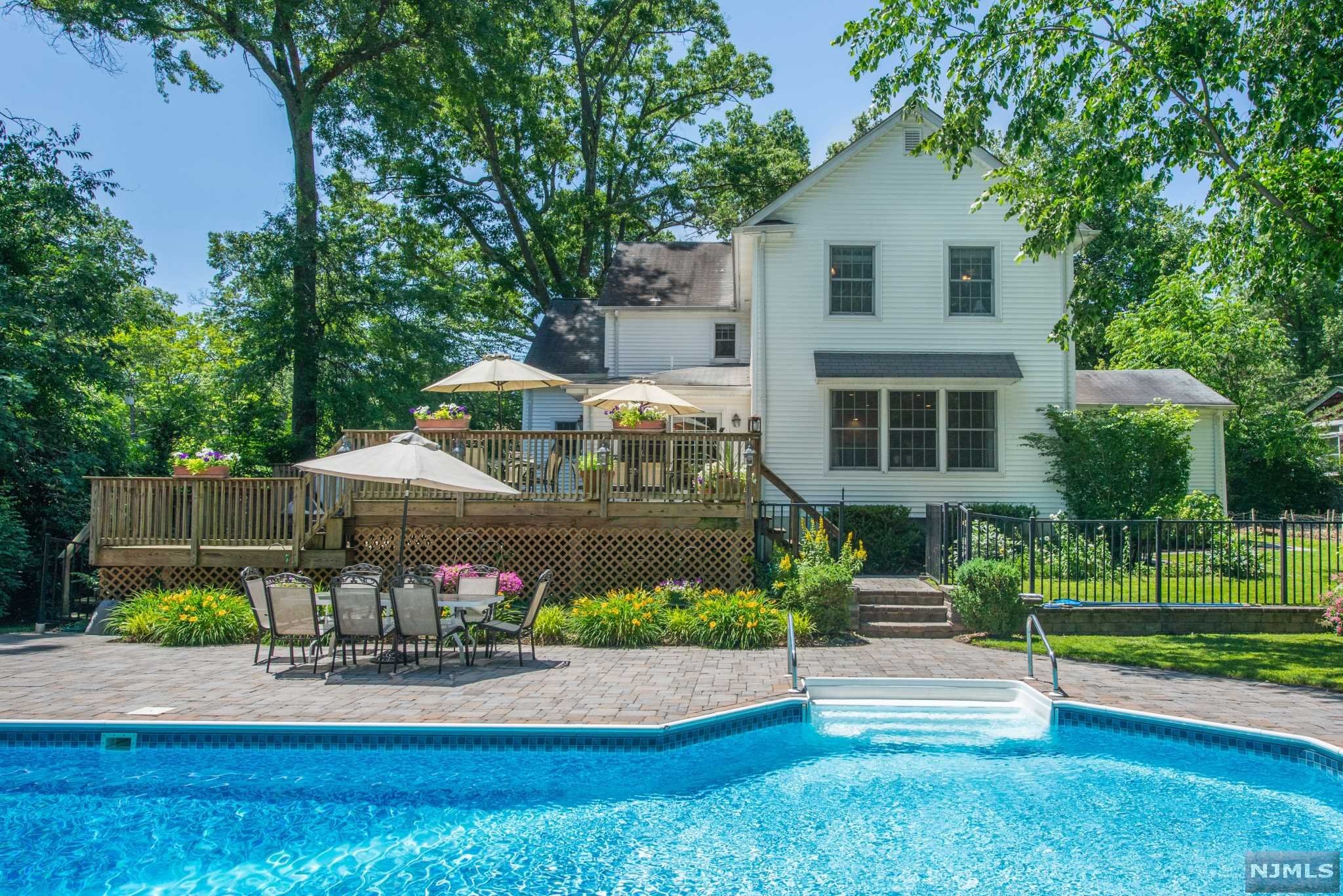 Welcome to the BERKSHIRES of Livingston! PAY ATTENTION: this is a ONE OF A KIND PROPERTY! Located on .84 acre this LUSH and PrivateEntertainment Complex houses an IN-GROUND Monarch Swimming POOL, Built-in Jacuzzi on a Multi-Level Deck, Pool CABANA w/Kitchen, Powder Room andChanging Area, and a full SPORTS COURT - PICKLEBALL Anyone??? And let's not forget the Main House - This Classic CENTERHALL 5 Bedroom + 3.2 BathColonial is located on a quiet bikeable street within a close stroll to Elementary School. Main Level Hosts Formal Living and Dining Rooms, Kitchen and FamilyRoom ADDITIONs with Picturesque Windows. 2nd Level hosts 5 Bedrooms + 2 Full bathrooms (includes Master En-suite.) Finished basement with Bonus roomand Additional full bathroom. This is truly a VACATION home within our own Blue Ribbon Livingston!