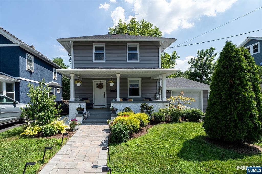 Welcome home to this immaculately maintained Maplewood Colonial. Completely renovated in 2021, this property is turnkey and ready for its new owners. 3 bedrooms, 2 full baths, and a full finished basement make this home the suburban dream in one of the best communities in North New Jersey. Enter through your spacious covered front porch, into your main floor featuring gorgeous hardwood floors and recessed lighting throughout. The living room has a beautiful brick accent wall with fireplace & mantel, leading to the open floor plan kitchen and dining room, where you will find stainless steel appliances, quartz countertops, and endless natural light from your lush backyard. Upstairs you will find three bedrooms and full bath including the spacious primary bedroom with an oversized closet. Enjoy your large finished basement with a full bathroom as a guest suite, home gym or playroom! There is additional storage in the utility room, french drains, and an outside entrance. The sweeping green backyard is completely fenced in and ideal for entertaining on the stone patio, with entrances up to the kitchen, and into the oversized garage, complete with EV charger! All this with the best that Maplewood has to offer, close to parks, locally owned shops and restaurants, fast and easy transportation to New York, and incredible community events all year long! Schedule your showing today!
