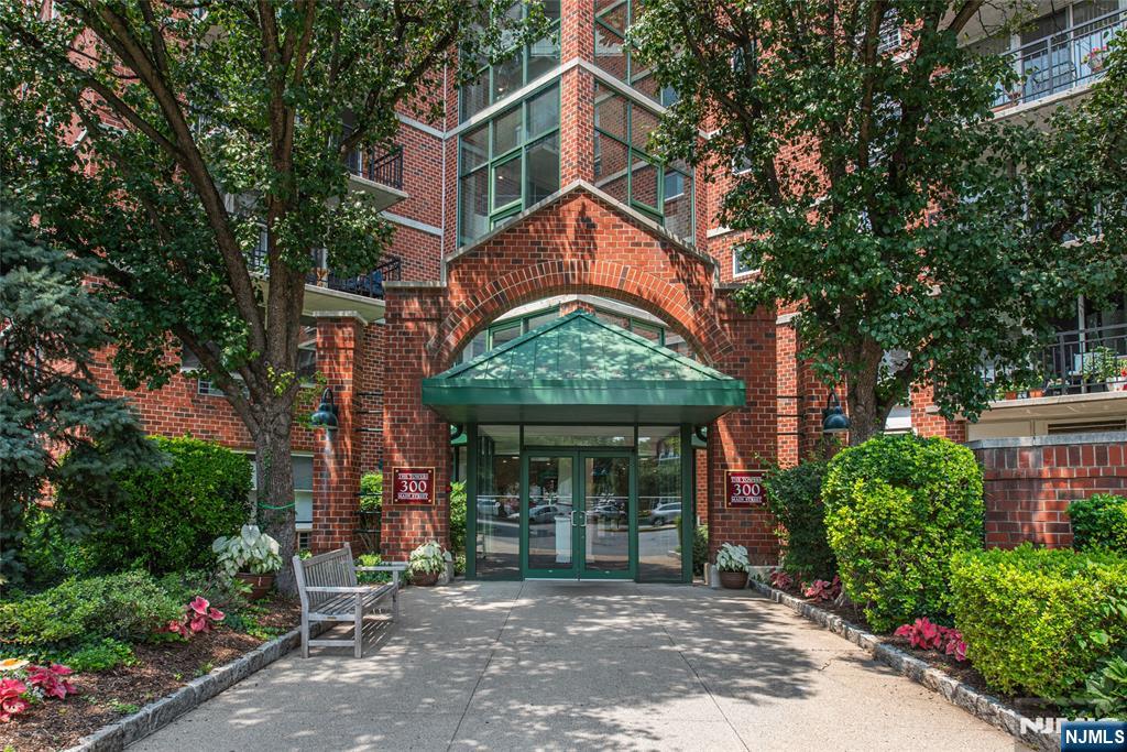 Welcome home to this spacious 1-bedroom corner-unit condo offering an expanded 827 sq. ft. floor plan. This light-filled unit features a private balcony, in-unit laundry, and assigned parking. Enjoy an array of amenities including a swimming pool, fitness center, tennis court, barbecue area, and scenic waterfall views, all within a pet-friendly community with beautifully maintained grounds. Ideal for commuters, the train station is just two blocks away and a bus stop is directly across the street, with easy access to major highways. Conveniently located near parks, restaurants, and shopping, including Willowbrook Mall. Don't miss this opportunity to enjoy comfort, convenience, and low-maintenance living in a prime location!