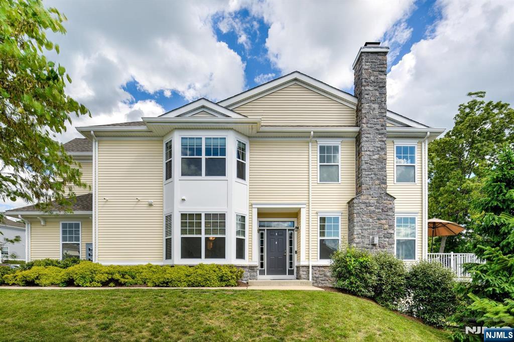 Welcome to 14 Lupine Lane, a beautifully appointed end-unit townhome in the highly desirable Panther Valley community. This spacious Augusta model 3-bedroom, 2.5-bath home with a 2-car garage offers an open & inviting floor plan designed for today's lifestyle. The main level features a open-concept layout highlighted by hardwood flrs, oversized windows that showcase spectacular views & natural light. The gourmet kitchen boasts 42" cabinetry, granite ctrs, SS appliances, a lrge center island with breakfast bar & seamless flow into the living & dining areas. The formal dining room is perfect for entertaining, spacious living room features a gas fireplace and direct access to a composite deck overlooking scenic surroundings. Upstairs, the Spacious primary suite offers tray ceilings, a large walk-in closet & Master bath complete with a soaking tub, stall shower, double vanity, and granite ctrs. Two additional generously sized bedrooms include ample closet space, with one featuring its own walk-in closet. A convenient 2nd flr laundry room w/ closet completes the upper level. The walk-out finished basement provides a versatile open-concept space ideal for a recreation room, home office, gym, media room, or guest area. Sliding doors lead to a private patio. Residents enjoy exceptional Panther Valley amenities, including 3 outdoor swimming pools, multi-sport courts, playgrounds, scenic walking trails & bike paths. Minutes to highways, shopping, dining & recreation.