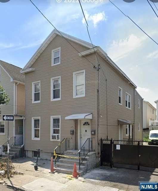Great investment opportunity multi family home located in the ironbound section of Newark. First floor 2 bedrooms, living room, bathroom & eat in kitchen. Second floor two floors with living room, 2 bedrooms, kitchen, bathroom, and 2 more rooms in the attic. Second floor also has central air conditioning. Partially Finished basement with separate utilities. Shared driveway with 5 parking spots in the back. House is SOLD AS IS and will be delivered vacant! Professional pictures to come.