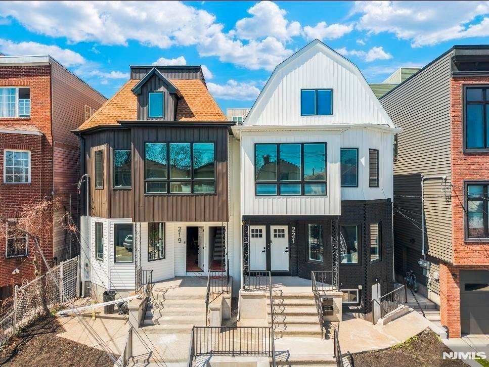 Exceptional investment opportunity in Jersey City's thriving Bergen-Lafayette neighborhood! This fully renovated 2-family duplex-style property offers two expansive residences, each spanning two(2) levels with 4 bedrooms and 3 full bathrooms, for a total of 8 bedrooms and 6 bathrooms. ideal for investors, Owner-occupants, or multi-generational living.Unit 1 features a spacious duplex layout with soaring ceilings, dramatic oversized windows, recessed lighting, hardwood floors, designer finishes, and an open-concept living, dining, and kitchen area centered around a large island. The finished walkout finished basement offers additional living space, a full bathroom, and direct access to a generously sized private backyard.Unit 2 offers an equally impressive duplex layout with 4 bedrooms and 3 full bathrooms, highlighted by abundant natural light, open-concept living, a designer kitchen with center island, and breathtaking New York City skyline views. The primary suite includes a private ensuite bath, creating the perfect retreat.Both residences have been thoughtfully renovated with modern finishes and functional layouts designed for today's lifestyle. Conveniently located near the hudson-Bergen Light Rail, Liberty State Park, restaurants, shopping, and major transportation routes with easy access to Manhattan. A rare turnkey multifamily opportunity with strong income potential in one of Jersey City's fastest-growing neighborhoods.