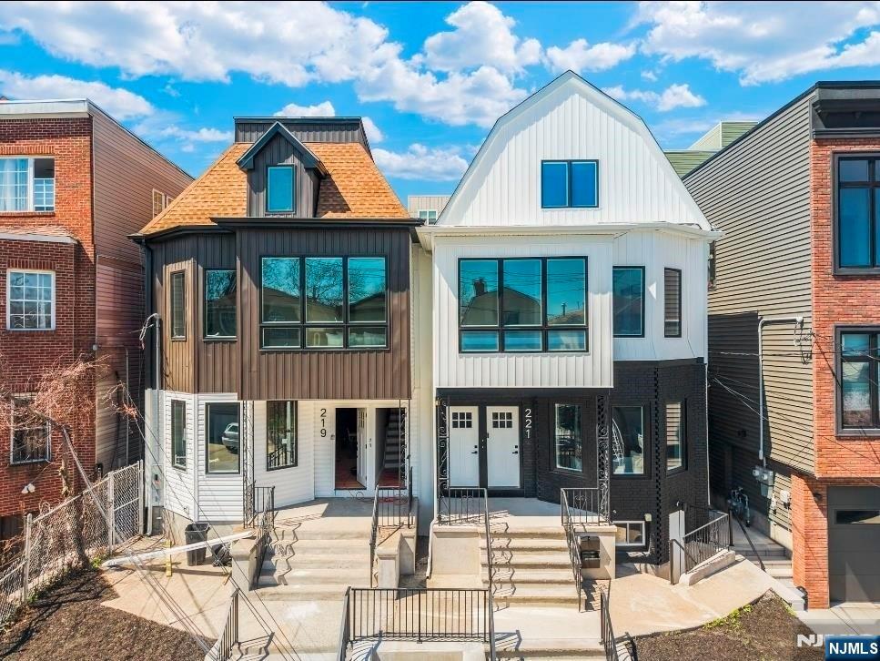 Exceptional investment opportunity in Jersey City's thriving Bergen-Lafayette neighborhood! This fully renovated 2-family duplex-style property offers two expansive residences, each spanning two(2) levels with 4 bedrooms and 3 full bathrooms, for a total of 8 bedrooms and 6 bathrooms. ideal for investors, Owner-occupants, or multi-generational living.Unit 1 features a spacious duplex layout with soaring ceilings, dramatic oversized windows, recessed lighting, hardwood floors, designer finishes, and an open-concept living, dining, and kitchen area centered around a large island. The finished walkout finished basement offers additional living space, a full bathroom, and direct access to a generously sized private backyard.Unit 2 offers an equally impressive duplex layout with 4 bedrooms and 3 full bathrooms, highlighted by abundant natural light, open-concept living, a designer kitchen with center island, and breathtaking New York City skyline views. The primary suite includes a private ensuite bath, creating the perfect retreat.Both residences have been thoughtfully renovated with modern finishes and functional layouts designed for today's lifestyle. Conveniently located near the hudson-Bergen Light Rail, Liberty State Park, restaurants, shopping, and major transportation routes with easy access to Manhattan. A rare turnkey multifamily opportunity with strong income potential in one of Jersey City's fastest-growing neighborhoods.