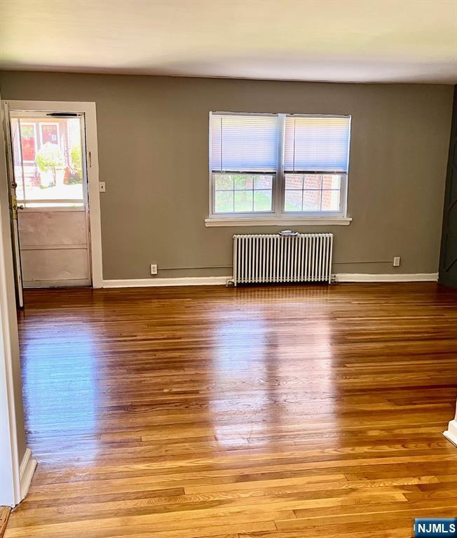 Bright first floor apartment in garden complex. Refinished hardwood floors throughout. Freshly painted . Tenant pays utilities. Close to NYC transportation, parks, shopping.
