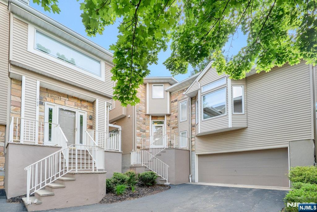 Welcome to this beautifully maintained Chelsea I model offering the perfect blend of space, flexibility, and lifestyle. This sun-filled townhome features 3 bedrooms one is private loft/bedroom, 2.5 baths, cathedral ceilings, and a finished basement designed to adapt to today's changing needs. A welcoming entry foyer showcases a custom floral inlay wood floor, setting the tone for the thoughtful details throughout. The first floor offers an open yet comfortable layout with formal living and dining rooms, soaring ceilings, and abundant natural light. The bright kitchen features stainless steel appliances, center island, pantry with stackable washer/dryer, and opens directly to the inviting family room with wood-burning fireplace and sliders leading to a private deck. Convenient first-floor powder room. Also on the first-floor, a primary suite: walk-in closet, custom shoe closet, & ensuite bath. Upstairs, enjoy a charming reading nook with built-in bookshelves, a large second bedroom with double closets, two bedrooms joined by a shared bath. The finished basement offers even more versatility: a game room, gym, media room, or office, plus storage, utilities, and laundry hookups. Located in sought-after Crystal Woods, community amenities include pool, tennis courts, pickleball courts, and playground. Conveniently located near houses of worship, shopping, dining, Target, Eagle Rock Reservation, the Oscar Schindler Performing Arts Center, & major commuting routes to Northern NJ.