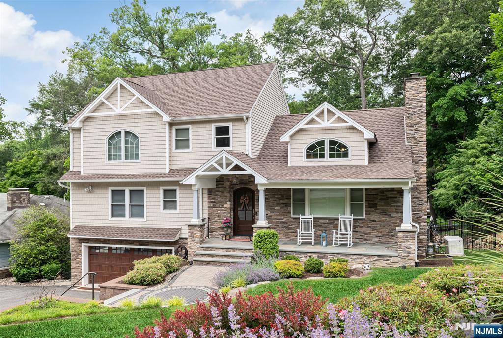 Welcome to 31 Osceola Road, an exceptional residence located in Wayne's highly sought-after Pine Lakes community, offering the perfect combination of modern luxury, smart-home convenience, and a true neighborhood lifestyle all within a 10-minutes to the lake. Completely remodeled in 2017, this stunning home was thoughtfully redesigned with everything updated from that renovation, providing today's buyers with the comfort, style, and confidence of a truly move-in-ready property. Designed for both everyday living and entertaining, the home features custom cabinetry throughout the kitchen, primary bedroom, and upstairs bathroom, showcasing quality craftsmanship and attention to detail. The impressive primary suite includes a spacious walk-in closet and a beautifully appointed bath. Technology and convenience are seamlessly integrated throughout the home with a premium Sonos speaker system extending through the kitchen, living room, dining room, primary bedroom, primary bath, and outdoor deck creating the perfect atmosphere indoors and out. All bedrooms, the family room, and basement are equipped with infrared wiring for cable, internet, and TV connectivity. Additional premium features include a whole-house generator for year-round peace of mind and a heated two-car garage, new garage door, and showroom-quality epoxy floo. This home delivers the rare combination of a modern fully updated home, premium upgrades, and the charm and lifestyle of Pine Lakes living.