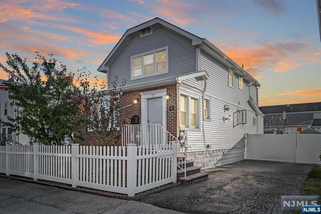 Welcome to this beautifully maintained 2-bedroom, 1.5-bathroom home in North Arlington, blending comfort, style, and functionality. Enter into a cozy mudroom before stepping into the open-concept main level, featuring a chef's kitchen with a large pantry, center island, and all appliances, including a washer and dryer. Skylights fill the living room with natural light, and a gas fireplace adds warmth. The spacious main bedroom offers flexibility as an office or guest room. Enjoy heated floors in the upstairs bathroom. Modern features include 2-zone central A/C, hot water baseboard heating, and an attic fan. The private backyard with fruit trees is perfect for entertaining. Private driveway for 2 cars. Conveniently located near public transportation and easy NYC access. This home has it all!