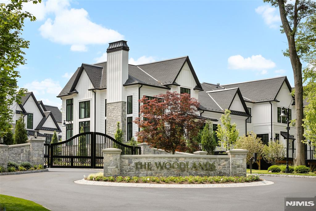 This exclusive, gated enclave of 24 newly constructed townhomes is perfectly appointed with a resident clubhouse, fitness center and private pool. Situated amidst 15 serene wooded acres with breathtaking views of the esteemed Alpine Country Club, 2 Stone Bridge Court is an 'Edgewood' floor plan featuring 3 bedrooms, 3.5 baths and 1 car garage and driveway. Designer Kuche+Cucina kitchen with SubZero & Wolf appliance package, modern spa baths, 10'+ ceilings throughout, whole home generator, air filtration system, smart home technology and much more. Conveniently located minutes from Manhattan, shopping, entertainment and transportation. Developed in collaboration with Zampolin & Associates Architects and Rock Ridge Construction. At The Woodlands, luxury living and natural beauty come together in an unparalleled setting designed for those seeking the finest lifestyle.