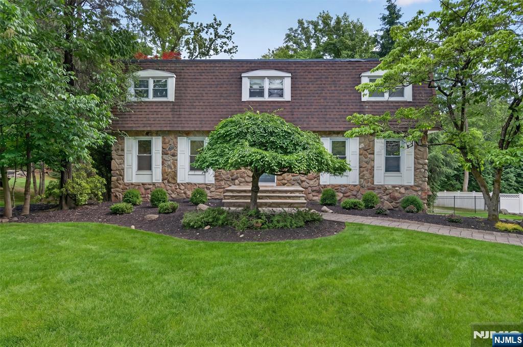 Classic 4 bedroom 2 1/2 bathroom colonial located in the sought after Oak Forest section of Northern River Vale. The entry foyer welcomes you to a formal living room and banquet sized dining room, eat-in kitchen with granite counter tops and stainless steel appliances. Sliders to a large 2 tiered deck overlooking an expansive, private and flat rear yard. The ideal setting for outdoor dining, gatherings and relaxing! Family room with wood burning fireplace, powder room and laundry complete the first level. The second floor features an expanded primary bedroom suite with a custom walk-in closet and 2 additional closets. Large primary bathroom with double sinks, make-up counter, jetted tub and large shower. 3 nice-sized bedrooms and a full bathroom complete the second level. Wonderful finished lower level with storage and a 2 car attached garage. Updates include a new roof and new air conditioning. Hardwood floors throughout, fenced-in yard and big plusâ€¦ busing to the middle and high school! Enjoy all that River Vale has to offer, top rated schools, convenient shopping and dining nearby, easy access to the Palisades Parkway and NYC transportation!