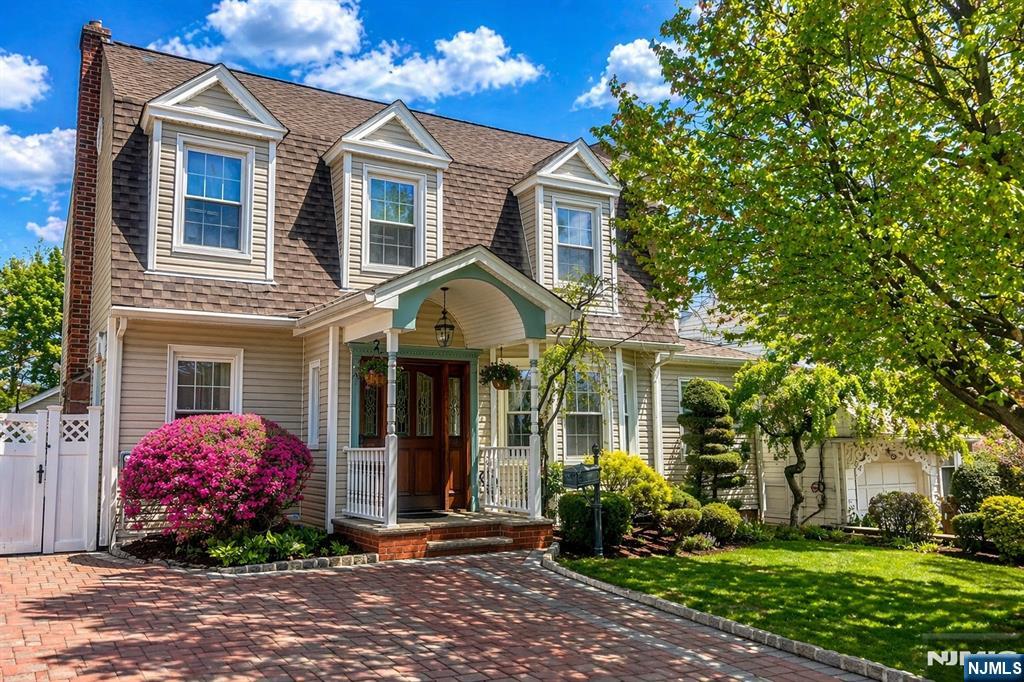 This 4 bedroom, 3 bath home is located in one of Hasbrouck Heights' most sought-after neighborhoods. Steps from downtown, top-rated schools, parks, and the Boulevard with midtown direct bus service to New York and close to nearby trains as well. Beautifully landscaped yard and stone driveway, with electric vehicle charging station setup in driveway. Inside, character and comfort meet. The living room centers on a wood-burning fireplace, framed by hardwood floors and oak trim. A formal dining room connects to the updated kitchen, which has its own dining area, ideal for morning coffee or casual meals. A flexible first floor room adapts to your needs: guest bedroom, home office, library, or den, with a bathroom right nearby. The primary suite delivers hotel-level comfort. Marble countertops and flooring, a soaking tub, and a walk-in shower define the spa-like bathroom. The bedroom offers abundant closet space and an upstairs washer dryer hookup.