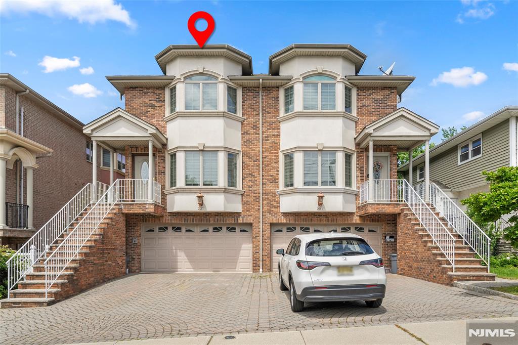 Located at 221 4th Street in the heart of Palisades Park, this spacious and well-maintained brick townhome offers a bright and functional layout ideal for comfortable living. Features include a ground-level guest/bonus room, hardwood floors throughout, and a modern eat-in kitchen with granite countertops. Step outside to a private wooden deck off the kitchen, perfect for entertaining, outdoor dining, or relaxing. Additional highlights include multiple-zone heating, central air conditioning, and convenient access to NYC transportation, shopping, restaurants, and major highways.