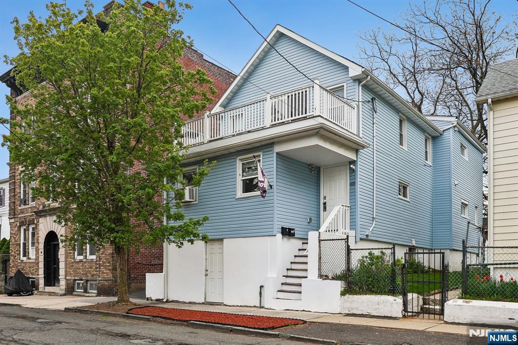 Updated 2 family residence ideally situated in a quiet, convenient Orange location. Just two blocks from NYC trains and close to schools/shops/restaurants! Top floor boasts private deck off the Primary Bedroom, Large Living room & Formal Dining Area, full bath & second bedroom - this unit is in PRISTINE condition (owner occupied)! Exterior highlights include a fenced-in yard, long, private asphalt driveway, separate motorcycle garage/shed. First floor also benefits from 2 large bedrooms, Living Room, Full Bath & Eat In Kitchen with walk out to backyard & private driveway! Bonus Ground floor features Family room, full bath, Utility room & additional unfinished storage space (Great separate guest suite) as it also enjoys direct walk-out access. Improvements done in 2021 include New Siding, windows, electric panels, electric wiring, all new pvc plumbing & more!