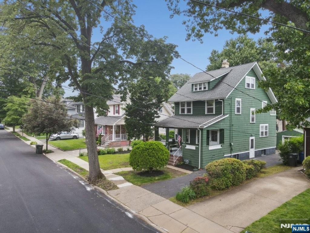 Charming Vintage Craftsman Side-Hall Colonial featuring beautiful original wood flooring throughout, including real parquet floors with elegant inlaid ribbon and bouquet details. This well-maintained home offers 7 rooms, including 4 bedrooms, 1.5 baths and enclosed 'Sleeping Porch'. A walk-up staircase leads to a fully finished third floor, providing excellent storage or expansion potential. Recent updates include a newer furnace, hot water heater, and Kitchen appliances for added peace of mind. Situated on a level 50' x 104' lot on a lovely residential street.