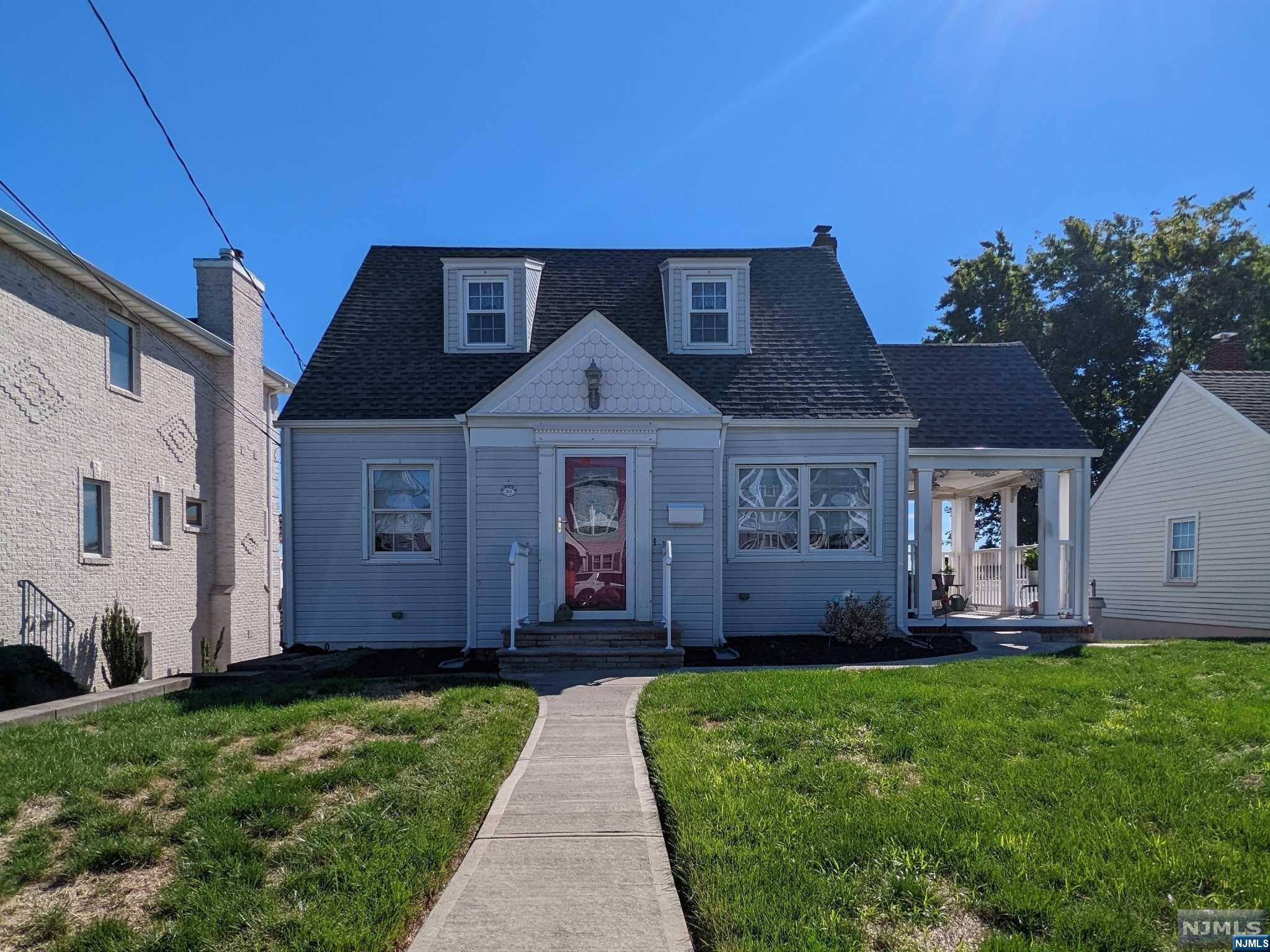 Lovely Cape Cod located on Beautiful Street in Desirable North Arlington. The 1st Floor of this Move in Ready home consists of an Open Floor Plan Living Room, Dining Room & Kitchen as well as a Bedroom and Main Bathroom. The Covered Outdoor Porch off the Living Room offers a perfect spot for that morning coffee or some relaxation in the evening. Trex Deck off the Kitchen offers a great location for a BBQ while enjoying the view of the NYC Skyline. The 2nd Floor boasts a Master Bedroom with En-Suite along with another Bedroom and Bonus Office Space with room for multiple desks. Attached Garage is accessible from the Rear of the Property and leads to the Unfinished Basement with Laundry Area. Parking for multiple cars in the Long Driveway. The Backyard offers plenty of room for entertaining with potential for a pool. The Roof & Gutters were installed about 2 Years ago. The HVAC was replaced about 3-4 years ago. Conveniently located to Transportation to NYC, Route 3 & Shops.