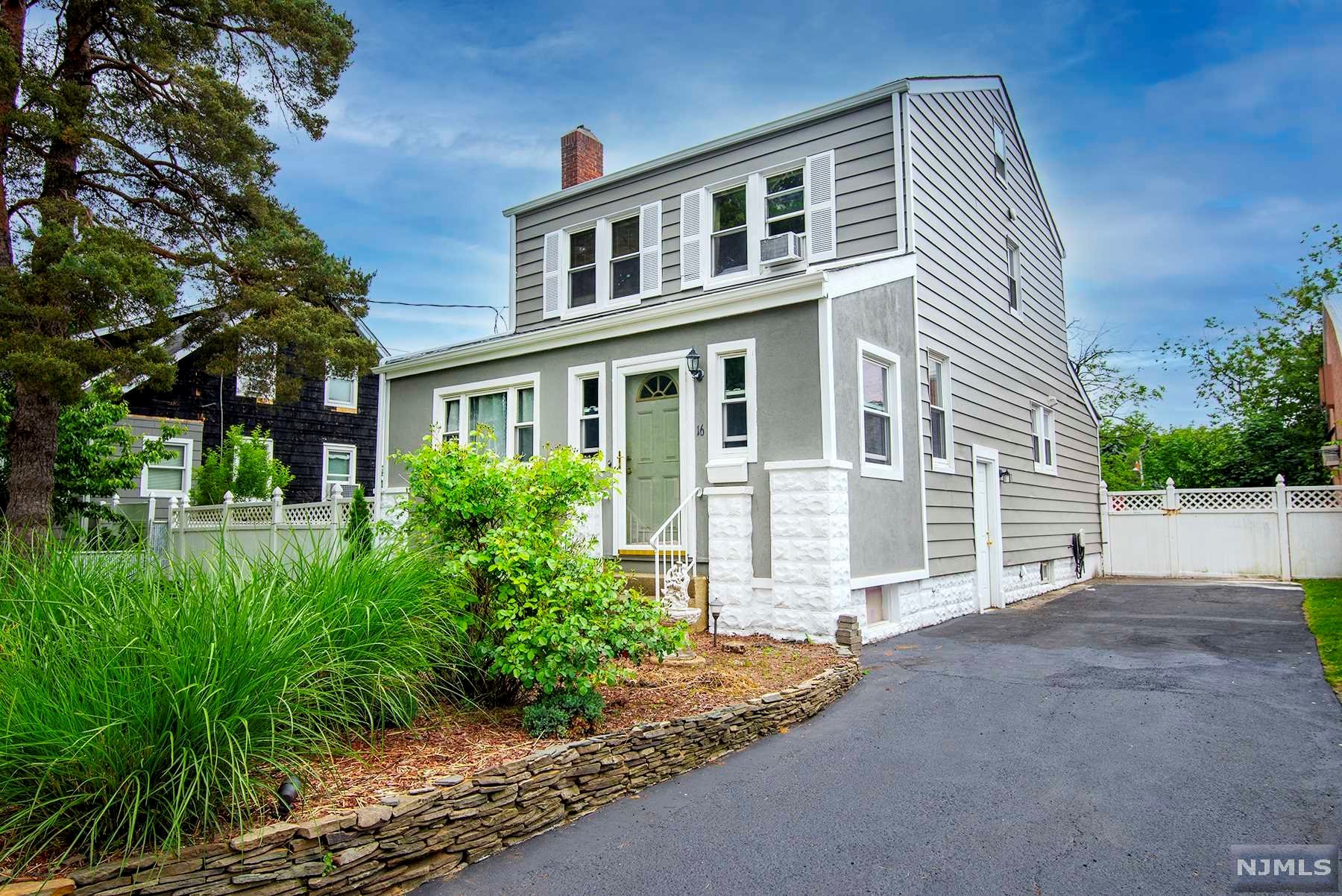 This move-in ready home is an exceptional value offering a NEW ROOF, newly paved driveway, oversized 60 x 117 property, and LOW TAXES (below $8k). Enjoy an open and flexible floor plan featuring high ceilings, a wood burning fireplace in the living room, 1st floor guest bathroom, mud room, finished basement, walk-up attic w/ ample storage space, large deck and a great yard perfect for entertaining. Prime commuter location w/ NYC Bus at the corner and conveniently located near shopping, restaurants, schools, and parks.