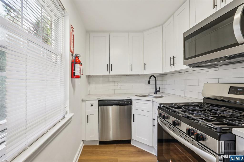 Discover comfortable living in this inviting 1-bedroom apartment located at 100 Huguenot Ave in the heart of Englewood, NJ. This well-maintained unit offers a spacious bedroom, a bright and airy living area, and a modern kitchen equipped with essential appliances. The apartment features hardwood floors, ample closet space, and large windows that fill the space with natural light. Residents enjoy convenient access to Englewoodâ€™s vibrant downtown, with its array of shops, restaurants, and entertainment options, as well as easy commuting to NYC via nearby public transportation. Perfect for professionals or small households seeking a blend of suburban charm and urban convenience. On-site parking and laundry facilities are available. Schedule a viewing today to experience this cozy retreat in a prime location!