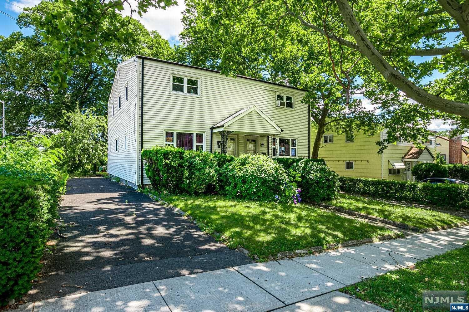 Charming end-unit half duplex home in the desirable neighborhood of Orange, NJ, blocks away from West Orange, Montclair and Maplewood. The top level offers 3 spacious bedrooms, each with ample closet space, wood floors and a full bathroom, tastefully designed. On the main level you will find a nice-sized living room, separate dining room, kitchen and 1/2 bathroom; all beautifully renovated. Both levels have central a/c and hardwood floors. The basement has a full-sized recreation room and laundry facilities. The home has a new roof and newer central a/c unit. Private driveway for convenient off-street parking for up to 4 vehicles. Beautifully landscaped backyard, perfect for relaxation. It's situated with easy access to local amenities and two blocks from NJ Transit rail service to New York City. This delightful home offers a perfect blend of comfort, convenience, and charm. Ideal for those seeking a tranquil living space. Owner is licensed real estate_agent.