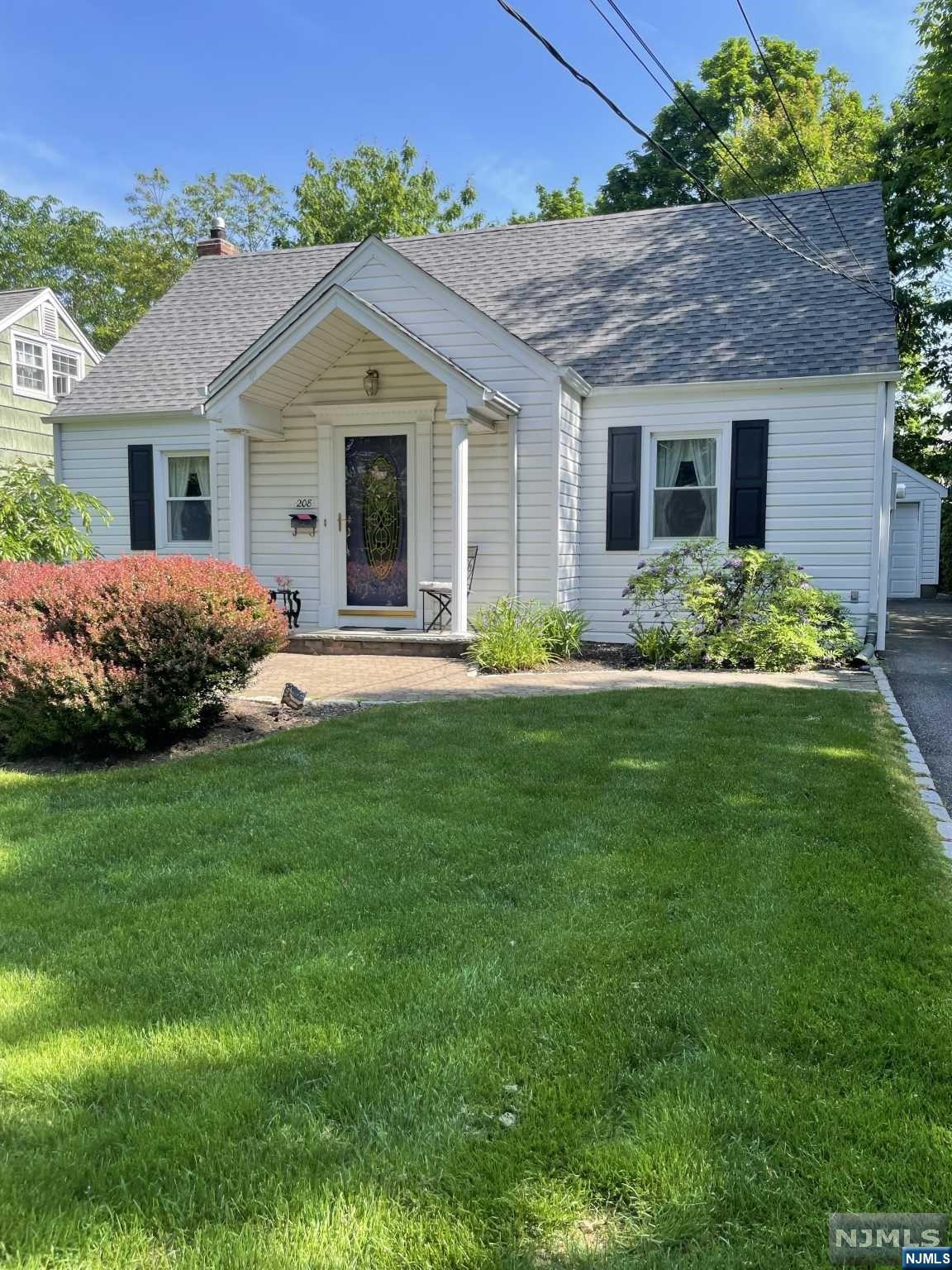 Welcome to this beautiful expanded cape cod style home. Renovated 10 years ago. This home offers all generous size rooms. The first floor has an entrance foyer, LR, DR, EIK, Primary Bedroom, Full Bath, All hardwood Floors, Kitchen has a sliding glass door to paver patio. The second floor offers 2 large bedrooms and a full bath.The home has central air conditioning on the first floor and each bedroom upstairs has a window air conditioner in place. The heating unit and hotwater heater is 2 years old. The roof is 4 years old. The exterior is vinyl sided. This property has a 1 car detached garage. The property is professionally landscaped. This home is in move in condition and shows pride of ownership.