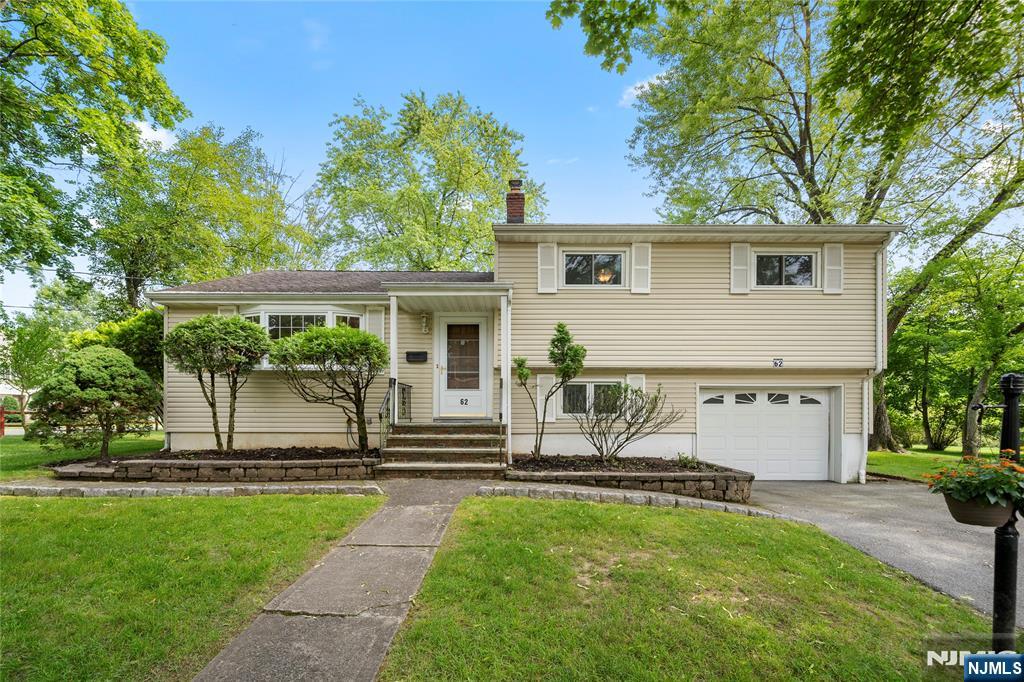 This lovely split level house with 3BRs and 2 Full baths is nestled in a calm, residential area of town. This home is full of comfort and offers ample space. Step into a spacious Living Room opening to Dining Room which flows into the updated kitchen. Abundant natural sunlight comes thru bay windows and a sliding glass door leading to the wooden deck. A few steps up and facing South the primary bedroom with big widow makes this room bright, overlooks a peaceful backyard. 2 other nice size Bedrooms and updated dual entrance Full Bathroom finishes the second floor. Hardwood floors are underneath all carpets. Central AC, ceiling fans & wide driveway plus an attached one car garage. The spacious yard provides room for various uses and entertaining. Located just minutes away Closter's vibrant downtown, top rated schools, shopping center, and house of worship. Home sold 'as -is'.