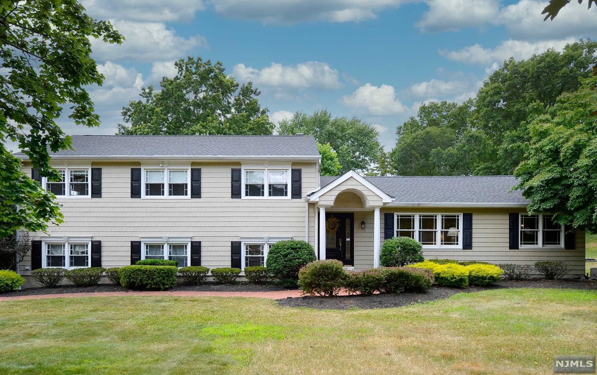 Get out your wish list and start checking off boxes! Great neighborhood - check! Great schools - check! Sparkling pool and lovely outdoor space - check! Beautifully updated, Master bedroom suite, Newer kitchen open to family room, hardwood floors, attached garages...it's all here. Bring your frilly toothpicks and cocktail napkins because you can move right in and be ready for a party tonight!