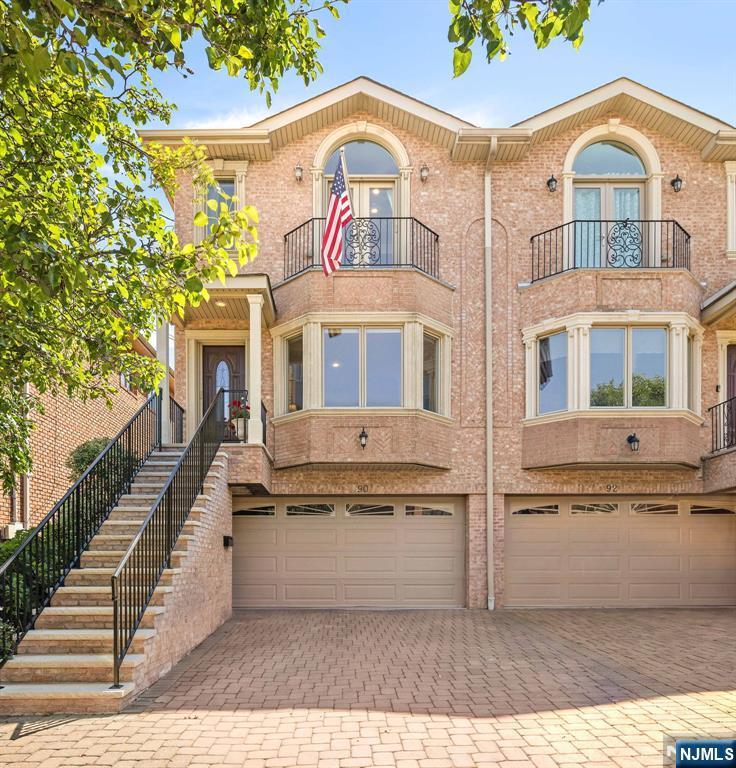 Welcome to 90 Washington Ave, a meticulously maintained move-in-ready townhome ideally situated east of Palisade Avenue in one of Cliffside Park's most desirable neighborhoods. This spacious residence offers 3 bedrooms, 3 full bathrooms, 1 half bath, combining modern upgrades, thoughtful design, and exceptional convenience. The home showcases numerous premium upgrades to elevate the experience including, newly renovated exterior stairs, fresh interior paint, motorized blinds, in-ceiling speakers, sleek retractable screens, a whole-house water filter & dehumidifier, and irrigation system. The gourmet kitchen is equipped with high-end appliances, including a BlueStar range and GE Cafe refrigerator with built-in Keurig coffee system creating the perfect space for both everyday living and entertaining. Step outside and entertain guests on an oversized Trex deck featuring a fully refurbished Weber Genesis 2 gas grill, custom irrigation for planters and ample room for outdoor dining. The third floor boasts a primary suite adorned with glass French doors that open to a private terrace and two additional bedrooms. The ground floor lower level features a bonus room which lends itself as a family room/gym, full bathroom, and access to a private covered patio oasis. Comfort and efficiency are further enhanced by a high capacity 10 ton air conditioning unit that keeps every corner cool and solar panels that generate approximately $4,800 in annual utility savings.