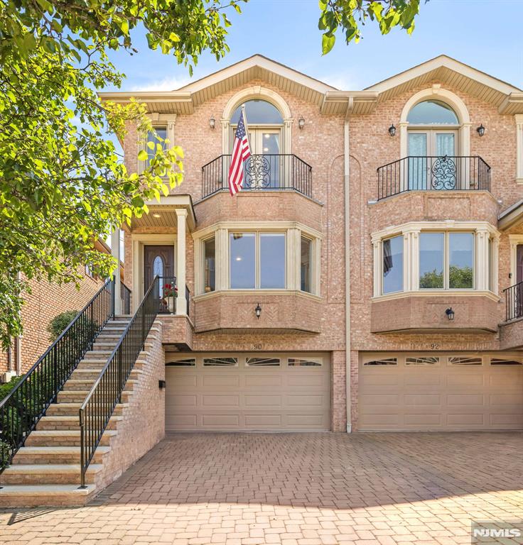 Welcome to 90 Washington Ave, a meticulously maintained move-in-ready townhome ideally situated east of Palisade Avenue in one of Cliffside Park's most desirable neighborhoods. This spacious residence offers 3 bedrooms, 3 full bathrooms, 1 half bath, combining modern upgrades, thoughtful design, and exceptional convenience. The home showcases numerous premium upgrades to elevate the experience including, newly renovated exterior stairs, fresh interior paint, motorized blinds, in-ceiling speakers, sleek retractable screens, a whole-house water filter & dehumidifier, and irrigation system. The gourmet kitchen is equipped with high-end appliances, including a BlueStar range and GE Cafe refrigerator with built-in Keurig coffee system creating the perfect space for both everyday living and entertaining. Step outside and entertain guests on an oversized Trex deck featuring a fully refurbished Weber Genesis 2 gas grill, custom irrigation for planters and ample room for outdoor dining. The third floor boasts a primary suite adorned with glass French doors that open to a private terrace and two additional bedrooms. The ground floor lower level features a bonus room which lends itself as a family room/gym, full bathroom, and access to a private covered patio oasis. Comfort and efficiency are further enhanced by a high capacity 10 ton air conditioning unit that keeps every corner cool and solar panels that generate approximately $4,800 in annual utility savings. Solar incl in sale price
