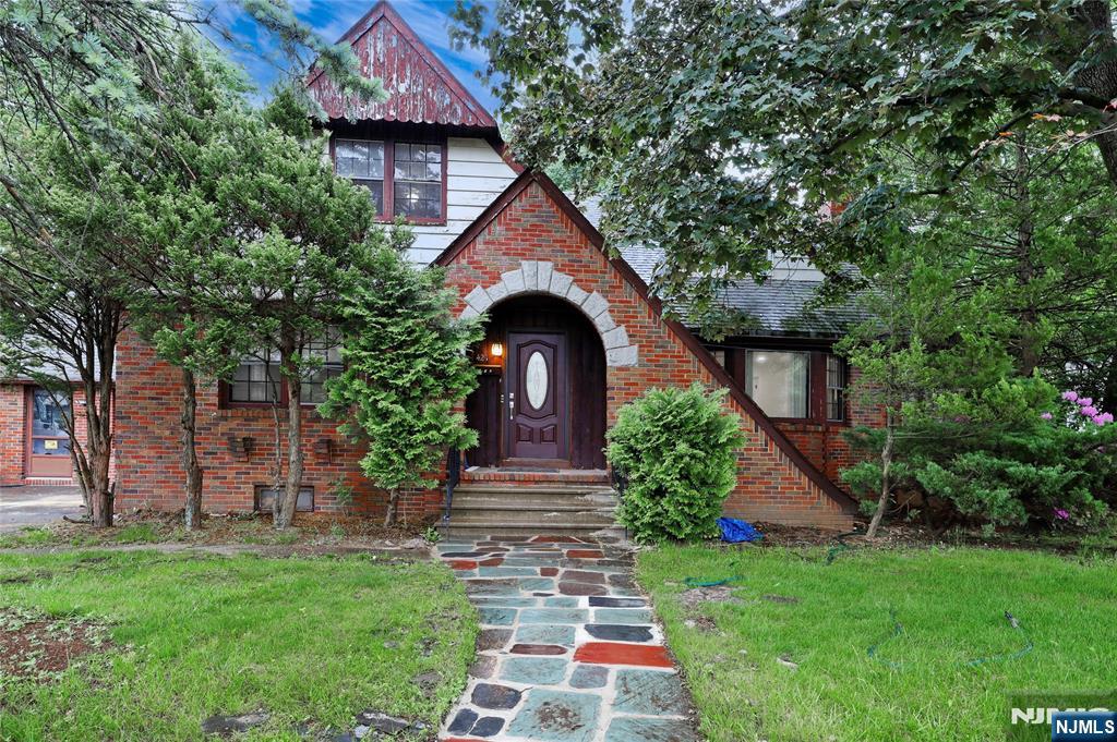 Welcome to this beautifully renovated, spacious 2-family home offering endless possibilities! The first-floor apartment boasts a gorgeous layout featuring a large living room with a stunning stone fireplace, a spacious modern eat-in kitchen with a dining area, a bonus room, and 3 generous bedrooms. In addition, this level includes a connected one-bedroom suite with a living room, full bath, and a separate side entrance, as well as an open studio-style space with a kitchenette and full bathroom, each offering perfect options for extended family, guests, or additional flexibility. The second-floor apartment features 2 bedrooms and 1 full bath, a large eat-in kitchen, and a living room. The fully finished basement, with its own separate entrance, provides a large, versatile area with 4 rooms, a laundry room, a full bath, and ample storage space. Enjoy a huge private, fully fenced backyard and ample parking space. Located in the B1 Mixed-Use Zone, this beautifully renovated and just-finished property offers exceptional investment potential and endless possibilities for future development. A rare find!