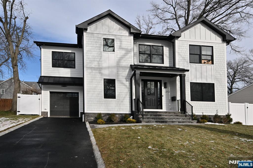 Love your life in this newly built, exceptional home on a picturesque tree-lined street in beloved River Edge. Designed for todayâ€™s open-concept lifestyle, it offers effortless flow, generous space, and modern comforts for everyday living and memorable entertaining. The sunlit eat-in kitchen features an island with seating, quartz countertops, premium appliances, extensive cabinetry, and a separate pantry, and opens seamlessly to the dining and living rooms with large windows, a cozy fireplace, and a coffee-and-wine wet bar & beverage fridge. A first-floor bedroom suite with full bath, a stylish powder room, a mudroom off the attached garage, and a welcoming foyer complete the main level. Upstairs, the elegant primary suite boasts vaulted ceilings, a custom walk-in closet, and a spa-inspired bath. A junior suite includes its own walk-in closet and full bath, joined by two additional spacious bedrooms, another full bath, and a large laundry room. The fully finished basement offers flexible bonus space for studying, gaming, or entertaining, plus a convenient powder room.Enjoy the best of suburban livingâ€”top-rated schools, fantastic shopping and diningâ€”and an unbeatable commute with two train stations, express bus service, and easy access to major highways, just minutes from the city.