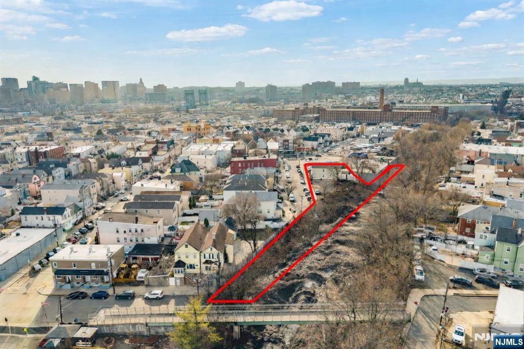 Investors and builders your opportunity to own a rarely available .5 acre of land with incredible development potential in Hudson Counties hottest towns is here. 416 Scott Mobus place is located near transportations, restaurants, minutes from the Red Bulls stadium and the path train for easy NYC access. The property currently features a two-family home that can be demolished to maximize the siteâ€™s potential. Surveys are available and plans are in place to build an additional two-family property. Any further development, plans, projects may require variance or town approvals. Buyers are responsible for conducting their own due diligence.