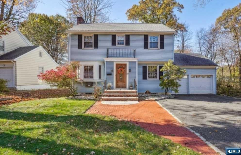 This charming colonial nestled on generous sized level lot has tons of character and endless potential! A storybook style colonial w/a rare two car garage. Enter into a foyer that has glass door that opens into the main living space. A ample sized living room greets you that is anchored with wood burning fire place, there are hardwood floors under the carpet and beyond the living room is an adorable sun drenched den w/sliders to a large deck, perfect for entertaining. The foyer also opens the formal dining room w/tons of natural light that leads to the kitchen, w/abundance of wood cabinets and counter space & door that also leads to the deck. The upper level features a primary bedroom w/large step in closet, two additional sizable bedrooms all w/HW floors & a quaint main bathroom. The LL features rec room, large storage space, powder room and gigantic storage, utility, laundry room. This adorable home could use some updating or utilize this prime lot location to renovate/build.