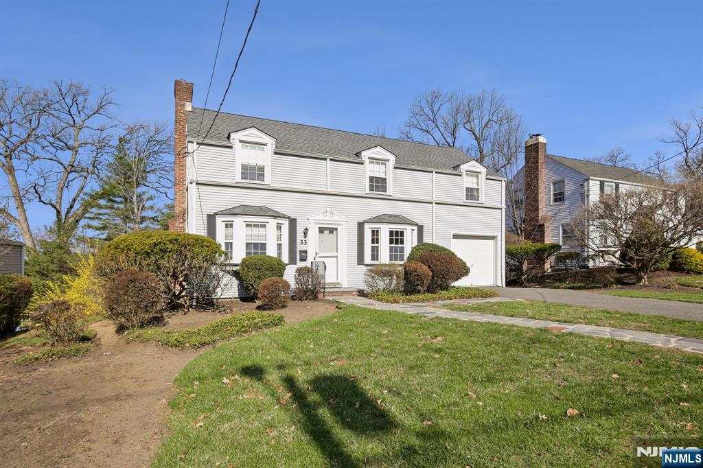 Classic 1940s Colonial located in the highly sought-after Presidential Section of West Caldwell. This charming home features hardwood floors throughout, a spacious living room with a fireplace and beautiful built-ins, and a bright three-season porch. The updated kitchen offers granite countertops, stainless steel appliances, and access to a large deck perfect for entertaining. A convenient powder room completes the first floor.Upstairs, you'll find three generously sized bedrooms and a full main bath. Additional highlights include a newer roof, insulated windows, central air conditioning, and a partially finished full basement providing extra living or recreation space.Enjoy all that West Caldwell has to offer, including top-rated schools, beautiful parks, and excellent dining options.Fireplace, chimney, and flue are being sold in as-is condition with no known issues. This home is being sold in as-is condition