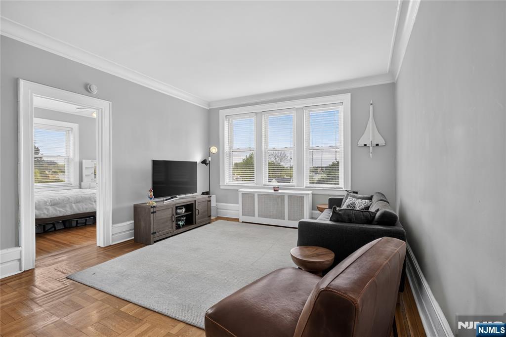 THE ULTIMATE NYC COMMUTER & DOWNTOWN LIFESTYLE CONDO! 1 Bedroom 1 Bath high ceilings unit with 1 assigned parking spot! Less than 5 mins to 2 direct NYC trains. Pre-war building preserved classic charm, crown moldings, gorgeous original hardwood floors & large windows offering abundant natural light. Pet Friendly! 1 Block away from restaurants, shops, theater and public transportation. This meticulously maintained corner condo boasts oversized windows in every room, deep closets and an open-concept living area. LOW HOA fee of $562.42 covers your heat, hot water, water, trash and snow removal. Unbeatable location: under 0.1 miles to Montclair's award-winning dining, boutiques, cafes, and museums. Laundry and extra storage available in the building. Ditch NYC rent and dive right into the Montclair lifestyle! Don't miss your chance to own a piece of one of New Jersey's most sought after cities.