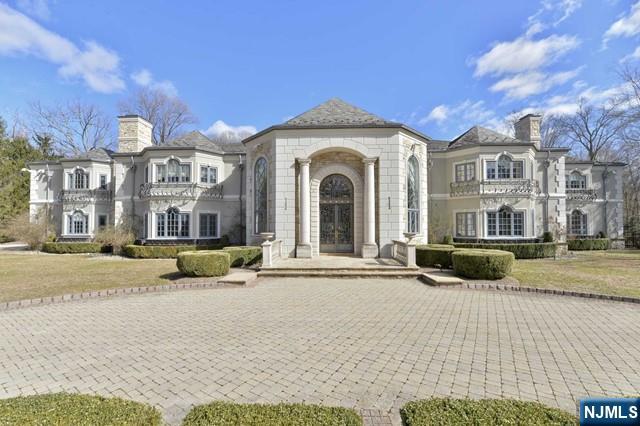 This approximately 20,000 sf residence was custom built for the original owner on approximately 4 lush acres. Hard coat European stucco exterior with stone enhancements and slate roof. Some of the unique features: award winning Theo Kalomirakis theater, a spectacular wine cellar and tasting room, indoor pool/spa, huge grand salon, 'Lion' solarium, multi-level office/library, multi room primary bedroom suite, boutique closet, "B&B" lagoon pool, cabana, and so much more! Estate is being sold in 'as is' and 'as in' condition.