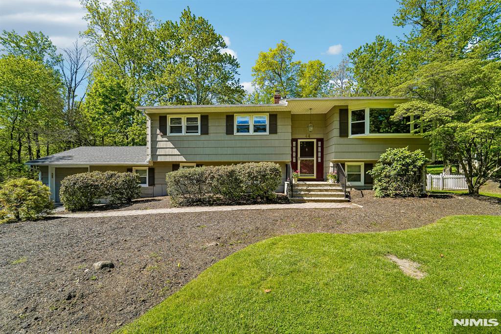 YOUR SEARCH IS OVER!! THIS HOME IS METICULOUSLY MAINTAINED, UPDATED TASTEFULLY, NESTLED ON AN ACRE OF FLAT LAND AND AMONGST MILLION DOLLAR PROPERTIES. ONE OF MAHWAH'S FINEST STREETS! THIS BI-LEVEL BOOSTS, 4 SPACIOUS BEDROOMS, WITH THE PRIMARY BATH UPDATED. THE KITCHEN HAS BEEN REDONE WITH MAPLE CABINETRY & S/S APPLIANCES. THE HARDWOOD FLOORS ARE GLEAMING THROUGHOUT. FRENCH DOORS OFF THE DINING ROOM LEAD TO A DECK. PERFECT FOR THE OUTDOOR BBQS. THE LIVING ROOM IS DESIGNED FOR ENTERTAINING. MOST WINDOWS HAVE BEEN REPLACED. THE LOWER LEVEL LEADS TO A FAMILY ROO0M W/SURROUIND SOUND, LAMINATE FLOORING AND SLIDERS TO A PAVER PATIO THAT OVER LOOKS THE PRIVATE BACKYARD. THERE ARE TONS OF CLOSETS FOR STORAGE AND A 4TH BEDROOM/OFFICE THAT HAS A PRIVATE ENTRANCE AROUND THE BACK. ENDLESS POSSIBILITIES FOR AN EXTENDED FAMILY. A FULL BATH IS ON THIS FLOOR ALSO. THE 1 CAR GARAGE HAS A BACK DOOR TO GET IN AND OUT FROM THE YARD. BESSLER STAIRS IN THE GARAGE FOR ACCESS TO ATTIC SPACE. THE FURNANCE IS 7 YRS OLD. & THE ROOF 3 YRS. THERES'S A SECURITY SYSTEM & FRENCH DRAINS AS WELL. THE HOME IS NEAR ALL THE SCHOOLS, MAJOR HIGHWAYS, AND SHOPPING, MAKING FOR A GREAT LOCATION. DON'T MISS THIS ONE!!!