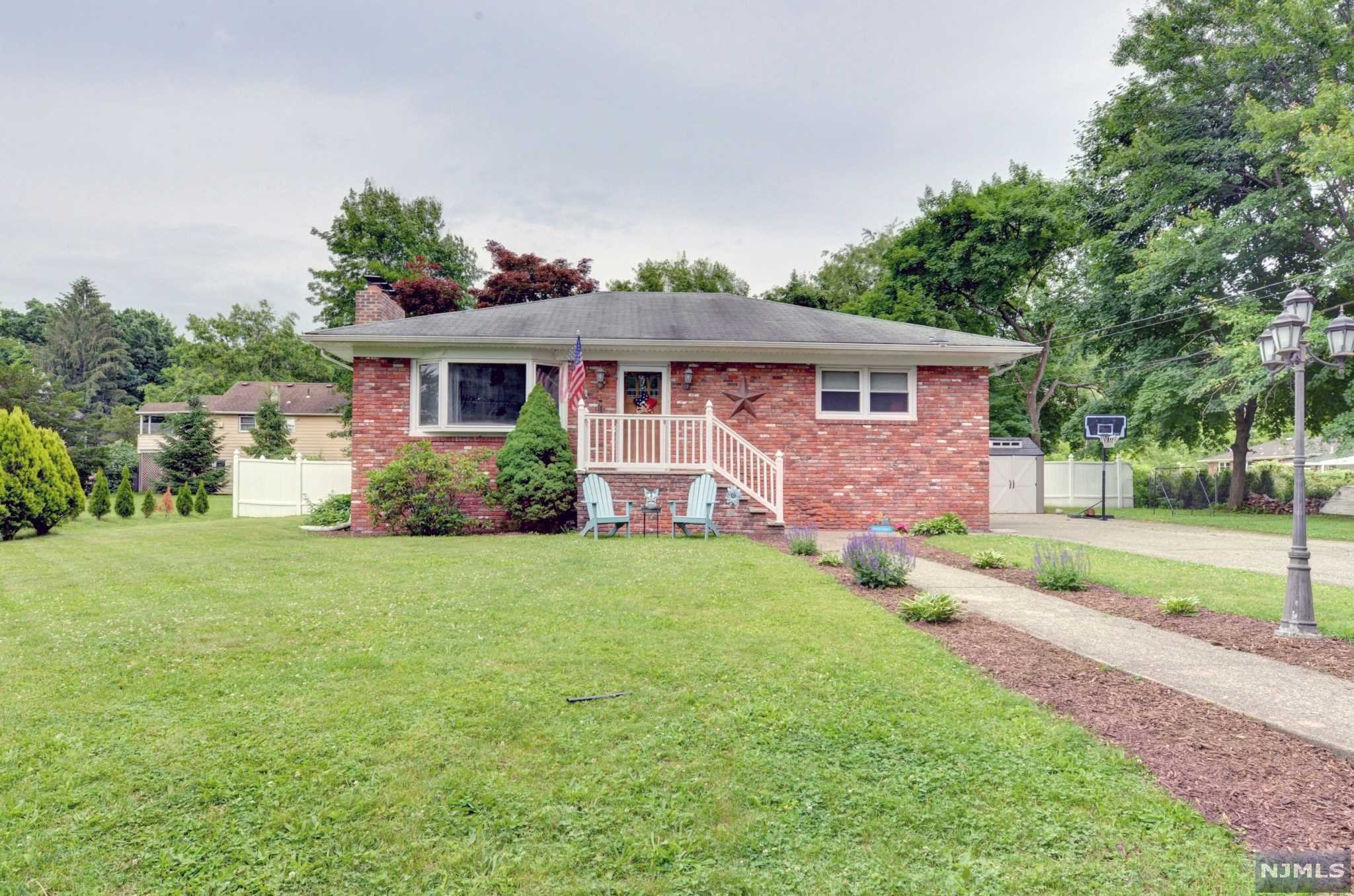 Adorable cottage style home with lots of charm! This home boasts a updated kitchen and open living room and dining room with wood burning fireplace! extra bonus room with sliders to patio and large yard. Full finished basement and lots of parking! Come and get it!