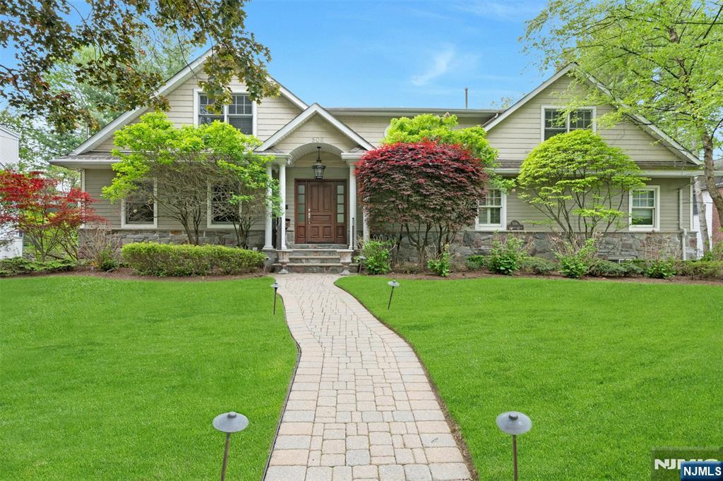 One of a kind custom home on 100 ft x 120 ft property in prime W Englewood Section. Spacious double height entry hall, formal dining room with Butler's pantry, ensuite primary bedroom with adjoining office or nursery, library. Second floor has 5 bedrooms plus laundry. Oversized high end finished basement with large windows, 2 car garage, 2nd laundry room and exit to back property. Gracious deck off Modern Eat in Kitchen overlooking property and basketball court.