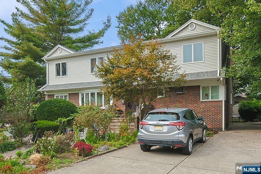 Two attached single-family homes on one lot, situated on a prestigious street in Fort Lee, NJ. The larger home features 6 bedrooms and 3 bathrooms, an open layout with a wood-burning fireplace, and was renovated in 2021. The home includes first-floor bedrooms, an additional second-floor living area with a walk-in closet, and ample closet space throughout. Additional highlights include a newer roof, finished basement, large backyard, and a 5-car driveway. The second home offers 2 bedrooms, a garage, and two separate living areas. This unique property offers flexibility for extended family living, rental income, or future developmentâ€”all in a prime Fort Lee location.