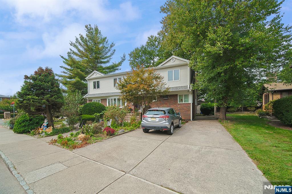 Two attached single-family homes on one lot, situated on a prestigious street in Fort Lee, NJ. The larger home features 6 bedrooms and 3 bathrooms, an open layout with a wood-burning fireplace, and was renovated in 2021. The home includes first-floor bedrooms, an additional second-floor living area with a walk-in closet, and ample closet space throughout. Additional highlights include a newer roof, finished basement, large backyard, and a 5-car driveway. The second home offers 2 bedrooms, a garage, and two separate living areas. This unique property offers flexibility for extended family living, rental income, or future developmentâ€”all in a prime Fort Lee location.