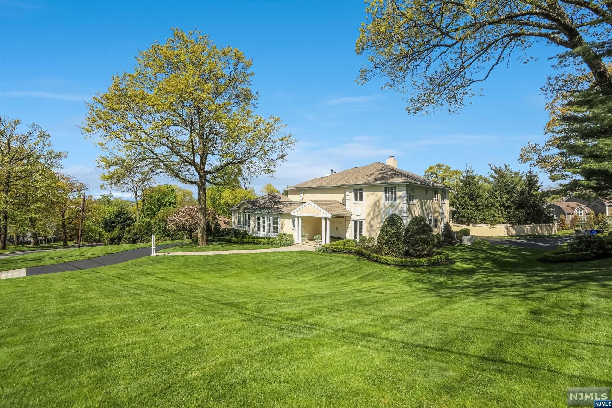 Enjoy luxury and style in this 7000 sqf custom home built in 1997 set on the East Hill of Englewood with Western views. This 6 bedroom, 8 bath home with heated pool and spa ,full house generator is set on 1 acre ,lushly landscaped with 4 car garages and two driveways. Spacious,open and bright, the home features high ceilings, floor to ceiling windows and hardwood floors. The gourmet kitchen with granite center island ,newly installed Wolf double oven, Wolf cooktop and 2 Miele dishwashers opens up to a large deck overlooking the grounds and pool. The main level offers 26x18 dining room, private library, family room w/ fireplace, office/bedroom, living room with vaulted ceilings,2 powder rooms. Second floor offers primary bedroom suite w/fireplace , marble bath with jacuzzi tub and spa like shower. 3 additional bedrooms with ensuite baths and walk-in closets, laundry. Walk out lower level includes recreation room, guest suite and 2 full baths.