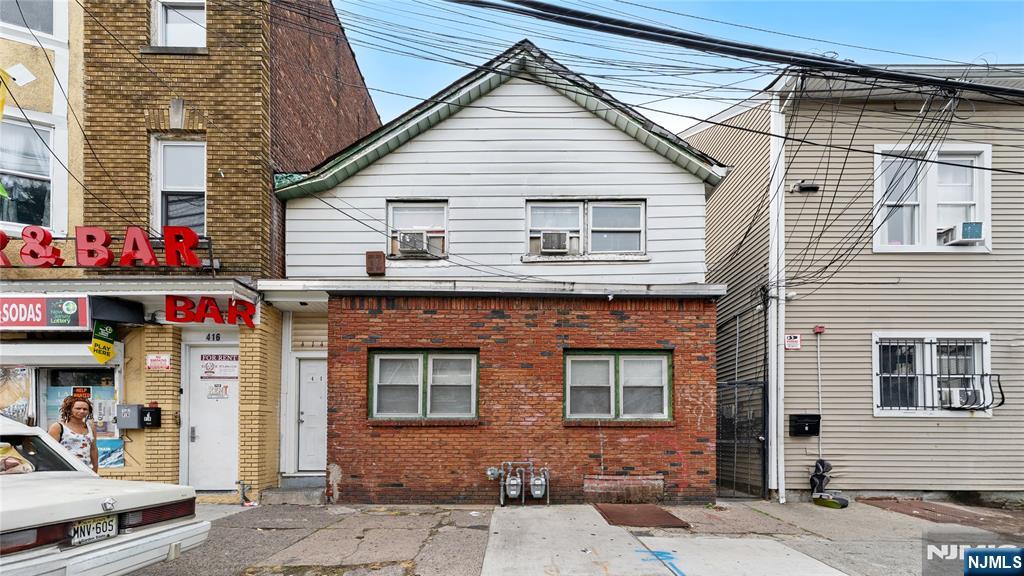 Welcome to 414 Market Street in Paterson, NJ, a two-family home situated in a convenient, city-style neighborhood close to shops, schools, and public transportation. The property offers a total of 4 bedrooms and 3 full bathrooms, with cozy, well-sized units that feature functional layouts and comfortable living spaces. The home would benefit from light updates, offering an excellent opportunity for buyers looking to add their personal touch and enhance value. Ideal for both investors and owner-occupants, this property presents flexibility, potential, and a commuter-friendly location. A great option for those seeking a multi-family home with upside.