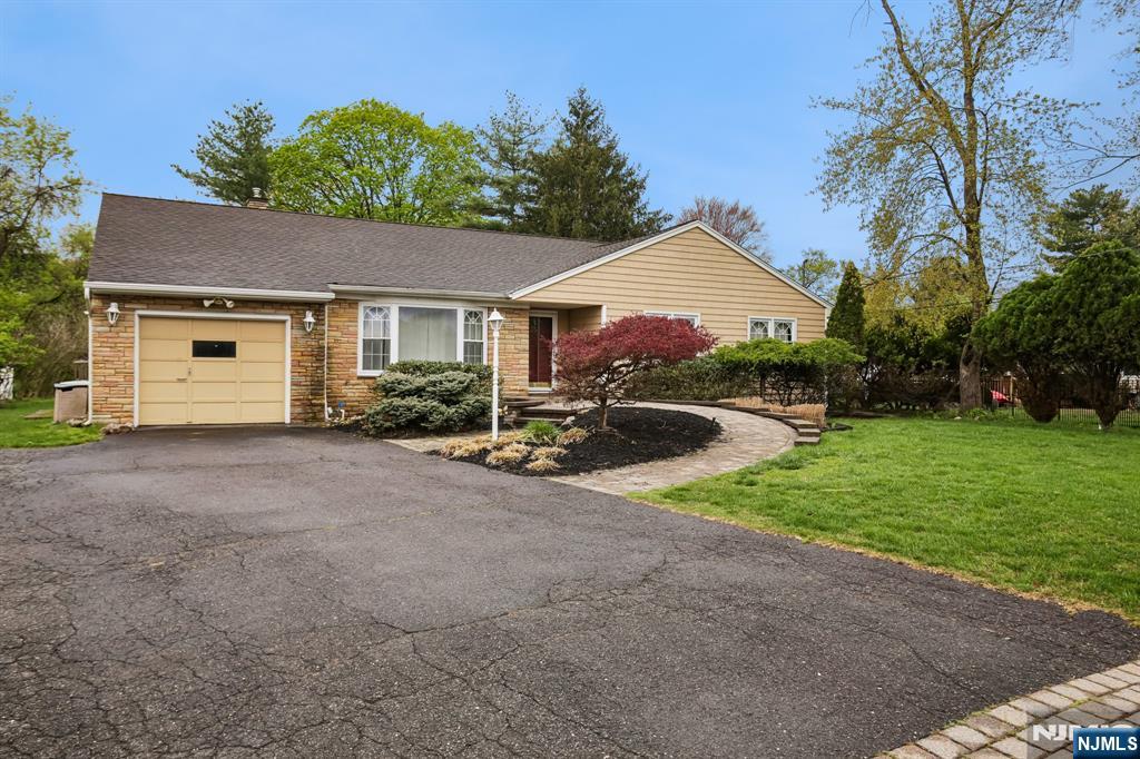 Welcome to your new home! In the desirable town of Pompton Lakes this 3BR/4Full Ba is waiting for its new owner. Located near schools,restaurants,shopping, and public transportation on a quiet side street. Enjoy single level living at its finest. Enter into an expansive entrance hall w/ a beautiful sunken LR to your left w/hrdwd floors and gas fireplace. Take a small step up and see your DR connected on both sides by a large kitchen w/center island, and large family room w/doors leading to your backyard. Windows are everywhere to let in the natural light. Off of the kitchen is the basement entrance as well as your laundry and another door leading to the backyard. Take a right after you enter and the hall leads to 3 roomy BR's. The first 2 BR's are on your right along with your first full bath with a HUGE shower. Keep going down the hall to your massive Primary BR complete with renovated Full BA featuring double sinks, soaking tub and shower. Primary has a double closet for all your clothes and shoes! Between the Primary and the laundry is a 3rd Full BA. Make your way downstairs to the partially finished basement complete w/rec,room,bonus room,w/closet and full Ba. Use as guest quarters or extra living space. The substantial backyard has a deck w/tv, firepit table and chairs as well as 2 sheds. Hardwood floors have been refinished and rooms have been painted. This is truly a great home, make your appointment before its gone!