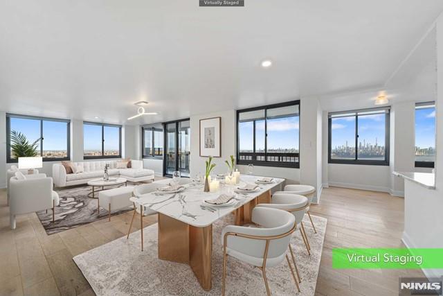 WENDY GAMEZ PRESENTS exceptional residence showcasing panoramic vistas at every turn in one of Winston Towers' premier corner homes, offering 1,963 sq. ft. of refined luxury and comfort. Residence 2409, a meticulously renovated 3-bedroom, 3-bath home, captures sweeping Hudson River and NYC skyline views from every angle, complemented by an oversized enclosed balcony, designer kitchen with premium stainless steel appliances and custom cabinetry, radiant heat, automatic shades, Smart Home technology, and NEW WINDOWS throughout. The luxurious primary suite features a spa-inspired bath with a steam shower, bidet, and an oversized walk-in closet. Thoughtfully redesigned with superior craftsmanship and high-end finishes, every detail reflects quality and sophistication. Enjoy full-service luxury living with 24-hour concierge, outdoor pool, tennis and basketball courts, children's playground, fitness center (under construction), and storage room, all included in the $1,250 monthly HOA. Parking available through the association (indoor $100, outdoor $75, tandem $150). Convenient NYC access via bus and NYC Waterway Ferry. Taxes: $15,970. A rare opportunity to own one of Cliffside Park's most spectacular view residences. Call today for a private tour!