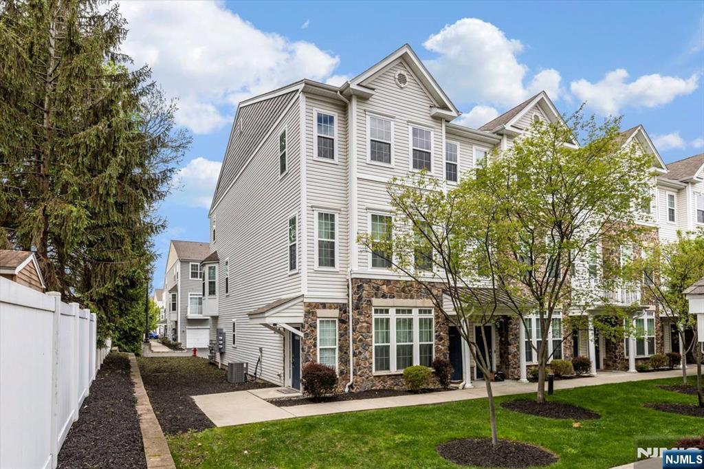 Nestled within a sought-after community in Garfield, this contemporary three-level townhomeâ€”built in 2015â€”offers both style and convenience, with easy access to NYC-bound trains and buses. The popular Davenport model features a well-designed main level with an open floor plan, showcasing a sun-filled living area, a formal dining space, powder room, and a kitchen complete with granite countertops, stainless steel appliances, and streamlined cabinetry. Upstairs, the generously sized primary suite includes a walk-in closet and a private full bathroom. This level also offers a second bedroom, an additional full bath, a flexible loft space perfect for a home office or play area, and a conveniently located laundry room. Comfort is enhanced by central air and forced hot air systems with multi-zone controls. Additional features include a private balcony and an entry-level garage with extra storage capacity. Residents enjoy a range of amenities, including a clubhouse with a fitness center, lounge, kitchen, billiards, conference space, and an outdoor pool. An ideal choice for commuters, professionals, or families, this home combines modern living with suburban comfort and close proximity to New York City.