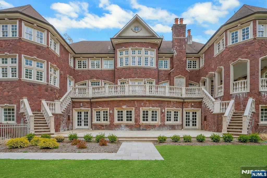 Welcome to an exceptional newly gut-renovated stone colonial manor blending timeless grandeur with modern luxury. Set behind private gates with sweeping western views, this 2 acre estate offers elegance, comfort, and thoughtful design throughout. A stately faÃ§ade opens to soaring ceilings, refined craftsmanship, and sunlit, expansive interiorsâ€”meticulously reimagined while preserving classic character. The sunken living room, w/dramatic heights and a striking fireplace anchors the home, while a mahogany library provides a quiet, refined retreat. Designed for entertaining, a billiards rm flows to a covered stone loggia overlooking the grounds creating seamless indoor/outdoor living. The chefâ€™s kitchen features top-tier appliances, custom cabinetry, and opens to a breakfast and family rm, plus a separate catererâ€™s kitchen for large events. An octagonal dining room adds a unique, elegant setting. The primary suite is a private sanctuary w/fpl, dual wardrobes, and a spa-like bath. 4 en-suite bedrooms and 2 guest rooms ensure comfort and flexibility. An oversized 3 car garage includes a 1,000-square-foot loft with kitchenette and bath. The bright lower level offers resort-style amenities: entertaining space w/wet bar and fireplace, theater, gym, golf simulator, and indoor cabana. Outdoors, a free-form pool and landscaped grounds provide privacy and stunning sunset views. This rare estate seamlessly combines classic elegance with modern livingâ€”offering a truly elevated lif